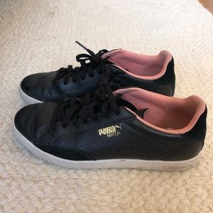 black leather PUMAs